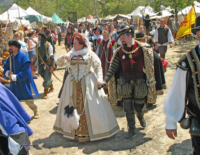 Royal couple in elaborate Renaissance faire costumes